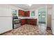 Kitchen with wood cabinets, stainless steel appliances, and tiled floor at 5665 Austell Powder Springs Rd, Austell, GA 30106