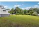 Large backyard with grassy area and mature trees at 5665 Austell Powder Springs Rd, Austell, GA 30106