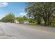Residential street with a house and trees at 5665 Austell Powder Springs Rd, Austell, GA 30106