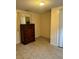 Simple bedroom with tile floors and a dresser at 4323 Union Church Rd, Mcdonough, GA 30252