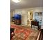 Living room with large rug, TV, and built-in shelving at 4323 Union Church Rd, Mcdonough, GA 30252