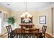 Formal dining room featuring a wood table and chandelier at 3280 Stillhouse Se Ln # 208, Atlanta, GA 30339