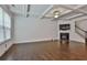 Gathering room with hardwood floors, fireplace, and coffered ceiling at 5661 Radford Loop, Fairburn, GA 30213