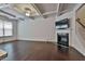 Gathering room with hardwood floors, fireplace, and coffered ceiling at 5661 Radford Loop, Fairburn, GA 30213