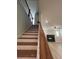 Modern staircase with wooden handrail and metal balusters at 110 Henley St, Canton, GA 30114