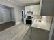 White shaker cabinets, stainless steel appliances, and quartz countertops at 916 Cascade Sw Rd, Atlanta, GA 30311