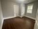 Bright bedroom with hardwood floors and double closets at 916 Cascade Sw Rd, Atlanta, GA 30311