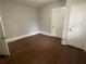 Hardwood floors and neutral walls in this bright bedroom at 916 Cascade Sw Rd, Atlanta, GA 30311