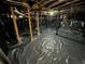 Unfinished basement with crawl space and support beams at 916 Cascade Sw Rd, Atlanta, GA 30311