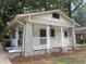 Charming bungalow with a front porch and gray stone accents at 916 Cascade Sw Rd, Atlanta, GA 30311