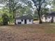 Large backyard with detached building and mature trees at 916 Cascade Sw Rd, Atlanta, GA 30311