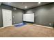 Basement media room with projector screen and carpet floor at 3756 Wood Hollow Way, Snellville, GA 30039