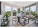 Bright dining room with modern table and chairs, and a wine rack at 101 Chestnut Trce # 14, Hapeville, GA 30354