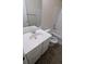 Clean bathroom with white vanity and bathtub/shower combo at 1269 Winwood Dr, Mcdonough, GA 30253