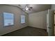 Spacious bedroom with carpet, ceiling fan, and two windows at 1269 Winwood Dr, Mcdonough, GA 30253