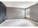 Grey bedroom with a chalkboard accent wall and carpet at 3973 Woodridge Way, Tucker, GA 30084