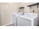 Bright laundry room complete with washer and dryer at 3973 Woodridge Way, Tucker, GA 30084