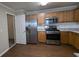 Updated kitchen featuring stainless steel appliances and wood cabinets at 3008 Summer Breeze Dr, Villa Rica, GA 30180