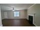 Spacious living room featuring hardwood floors, fireplace, and neutral color palette at 3008 Summer Breeze Dr, Villa Rica, GA 30180