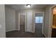 Hallway with doors to bedrooms and bathroom at 3008 Summer Breeze Dr, Villa Rica, GA 30180