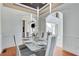 Elegant dining room with a glass table and modern chairs at 105 Ensley Pt, Fayetteville, GA 30214