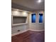 Finished basement with recessed shelving and hardwood floors at 105 Ensley Pt, Fayetteville, GA 30214