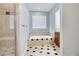 Bathroom with a soaking tub and a tiled shower with glass enclosure at 105 Ensley Pt, Fayetteville, GA 30214