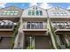 Three story townhouses with balconies and lush landscaping at 697 Eustace Se St, Atlanta, GA 30315