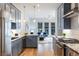 Modern kitchen with stainless steel appliances and blue cabinetry at 697 Eustace Se St, Atlanta, GA 30315