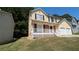 Two-story house with a covered porch and two-car garage at 2450 Northmill Ln, Decatur, GA 30035