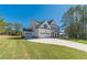 Two-story home with attached garage and manicured lawn at 91 Pinewood Dr, Covington, GA 30014