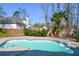 Inviting kidney-shaped pool, with a partially visible house in the background at 6619 Bass Cir, Buford, GA 30518