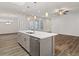 Kitchen island with sink, dishwasher, and white countertops at 170 Harvest Trl, Hiram, GA 30141