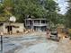 Large backyard with a two story gray building, picnic table, and basketball goal at 678 Quillian Ave, Decatur, GA 30032