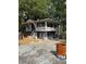 Elevated home with wrap-around porch and mature trees at 678 Quillian Ave, Decatur, GA 30032