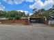 Ranch style home with carport and brick wall at 678 Quillian Ave, Decatur, GA 30032