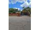 Yellow house with brick fence and gated driveway at 678 Quillian Ave, Decatur, GA 30032