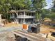 Two story gray building in the backyard with a deck at 678 Quillian Ave, Decatur, GA 30032