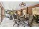 Cozy screened porch with stone patio, seating area, and ceiling fans at 4405 Clack Rd, Auburn, GA 30011