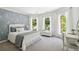 Spacious bedroom with gray accent wall and ample natural light at 4405 Clack Rd, Auburn, GA 30011