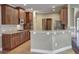 Kitchen with wood cabinets, granite countertops, and stainless steel appliances at 1791 Rosehedge Nw Way, Kennesaw, GA 30152