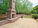 Brick fireplace and patio with backyard access at 1791 Rosehedge Nw Way, Kennesaw, GA 30152