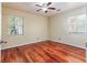 Bedroom with hardwood floors and two windows at 1515 Stone Gate Se Ln, Atlanta, GA 30317