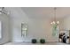 Bright dining room features hardwood floors, chandelier, and large windows at 7650 Abbey Glen Dr, Cumming, GA 30028