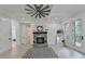 Bright living room with fireplace, built-ins, and hardwood floors at 7650 Abbey Glen Dr, Cumming, GA 30028