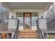 Modern front entrance with wooden door and railings at 975 Welch Sw St, Atlanta, GA 30310
