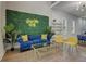 Stylish living room with blue sofa and statement wall at 975 Welch Sw St, Atlanta, GA 30310