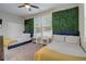 Bedroom with two twin beds and a green accent wall at 975 Welch Sw St, Atlanta, GA 30310