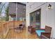 Private backyard with a wooden deck, string lights, and seating area at 975 Welch Sw St, Atlanta, GA 30310