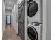 Laundry room with stacked washer and dryer, and barn door at 975 Welch Sw St, Atlanta, GA 30310